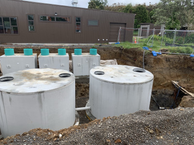 Wastewater tanks being installed in the ground