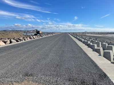 Road with surrounding sea wall construction.